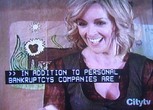 ‘30 Rock’ episode showing scrollup captions from an unrelated news program